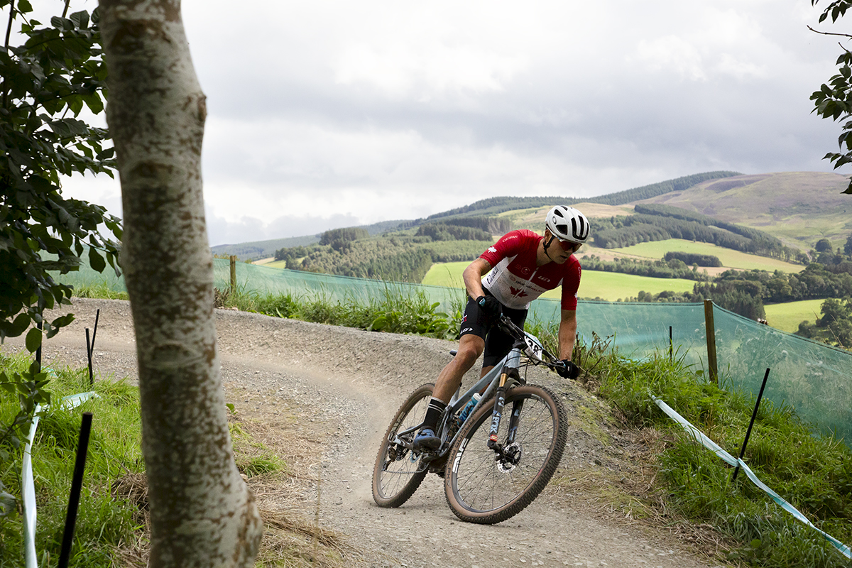 2023 UCI Cycling World Championships - Mountain Bike - Elite Men - Gunnar Holmgren of Canada exits the berm with the Scottish Borders behind