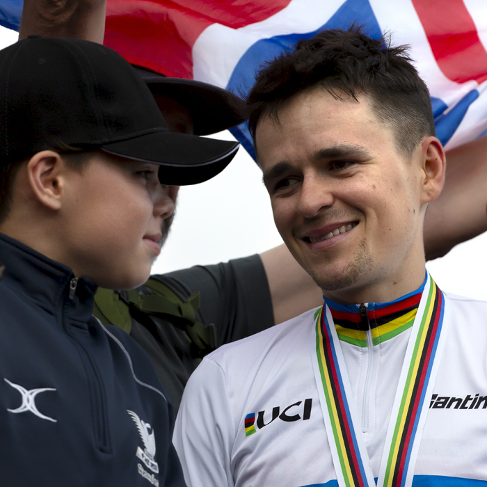 2023 UCI Cycling World Championships - Mountain Bike - Elite Men - Tom Pidcock of Great Britain with a young fan in the crowd and a Union Jack flag behind him