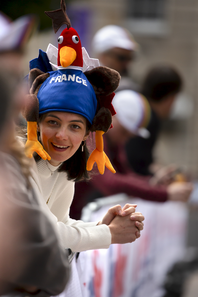 2023 UCI Cycling World Championships - Road Race - Elite Men - A French Fan wearing a hat in the shape of a cockerel excitedly awaits the race