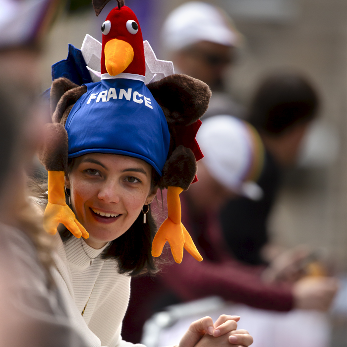 2023 UCI Cycling World Championships - Road Race - Elite Men - A French Fan wearing a hat in the shape of a cockerel excitedly awaits the race