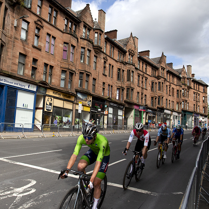 2023 UCI Cycling World Championships - Road Race - Elite Men - Tadej Pogačar of Slovenia leads a group down High Street