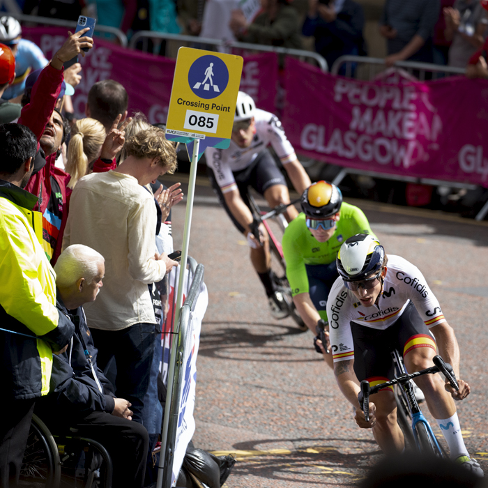 2023 UCI Cycling World Championships - Road Race - Elite Men - Spain’s Iván García Cortina leads a group round the corner as fans watch on