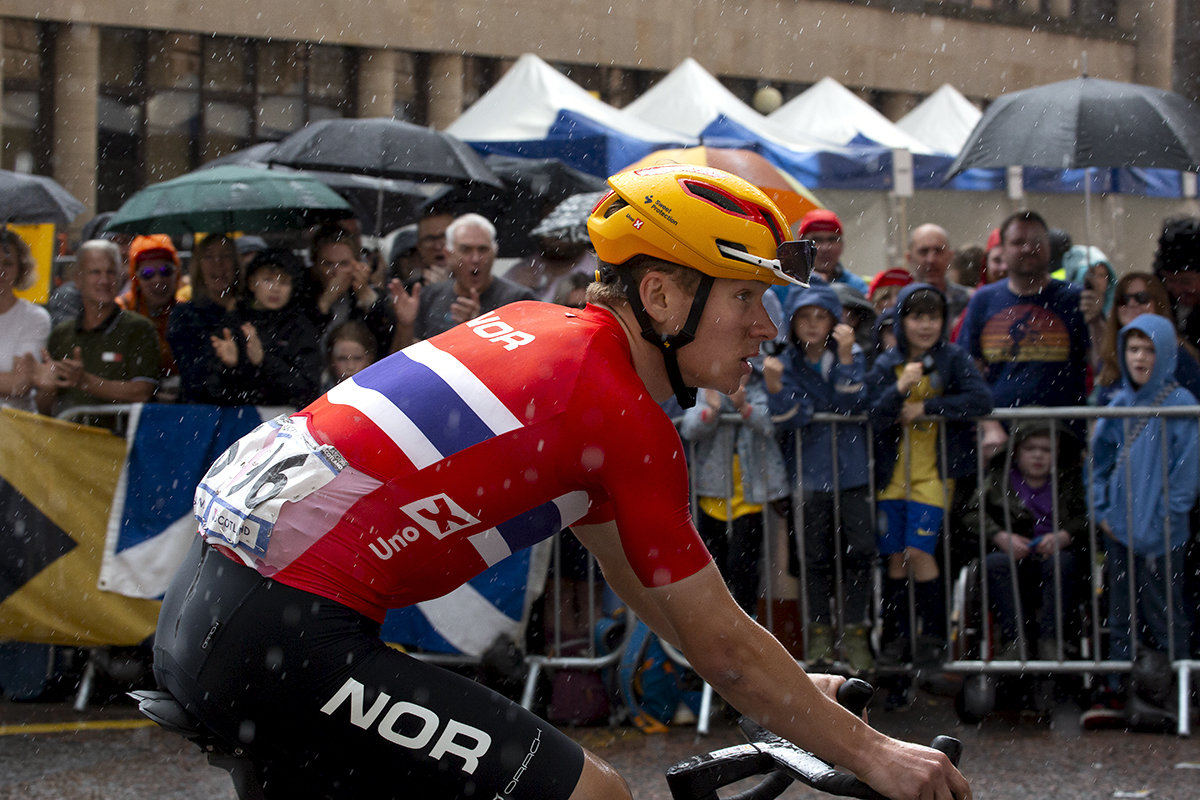2023 UCI Cycling World Championships - Road Race - Elite Men - Jonas Abrahamsen of Denmark glances up at the hill of Montrose Street as the rain falls