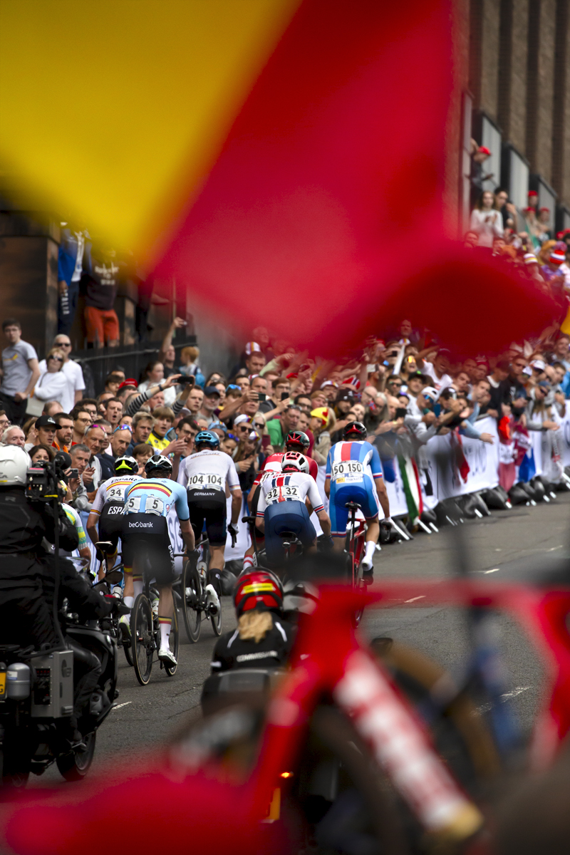 2023 UCI Cycling World Championships - Road Race - Elite Men - A Belgian flag waves as riders ascend Montrose Street