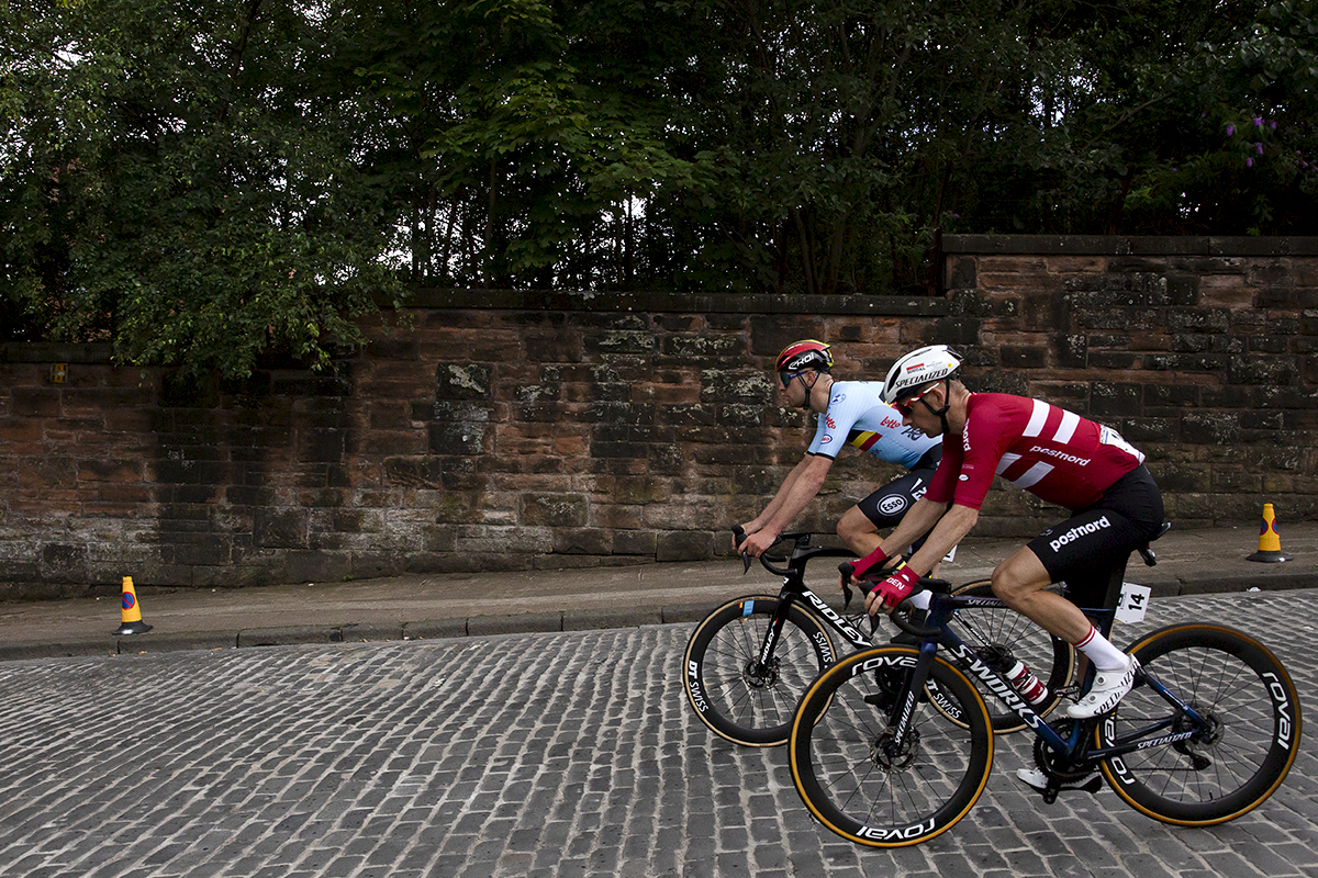 2023 UCI Cycling World Championships - Road Race - Elite Men - Michael Mørkøv of Denmark and Belgium’s Frederik Frison on the cobbles of Rottenrow