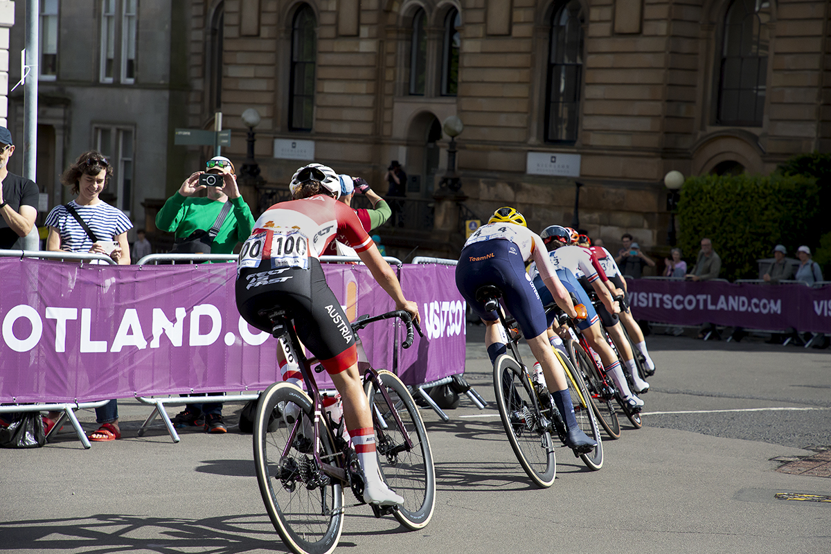 2023 UCI Cycling World Championships - Road Race - Elite Women - A rear view of the riders as they round the corner out of Lynedoch Place