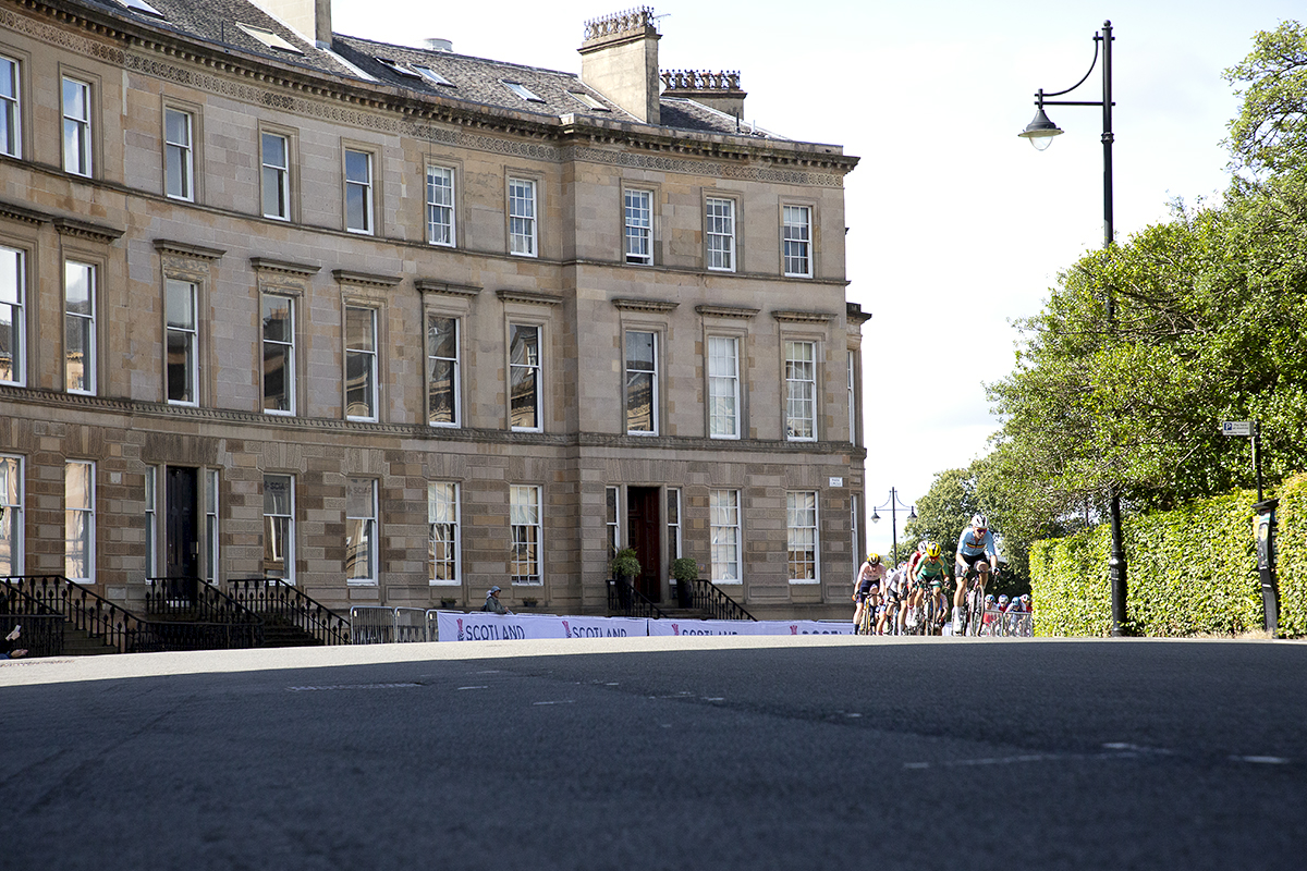 2023 UCI Cycling World Championships - Road Race - Elite Women - The peloton passes through a grand crescent of Georgian buildings