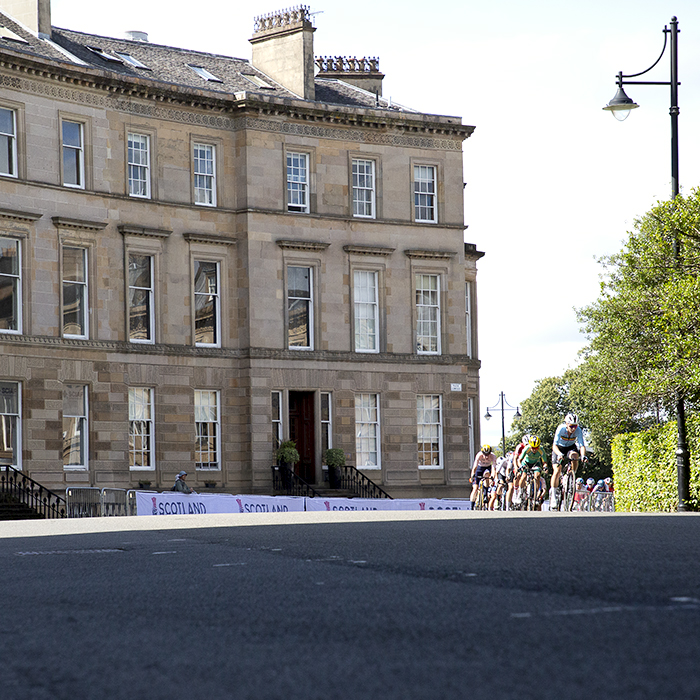 2023 UCI Cycling World Championships - Road Race - Elite Women - The peloton passes through a grand crescent of Georgian buildings