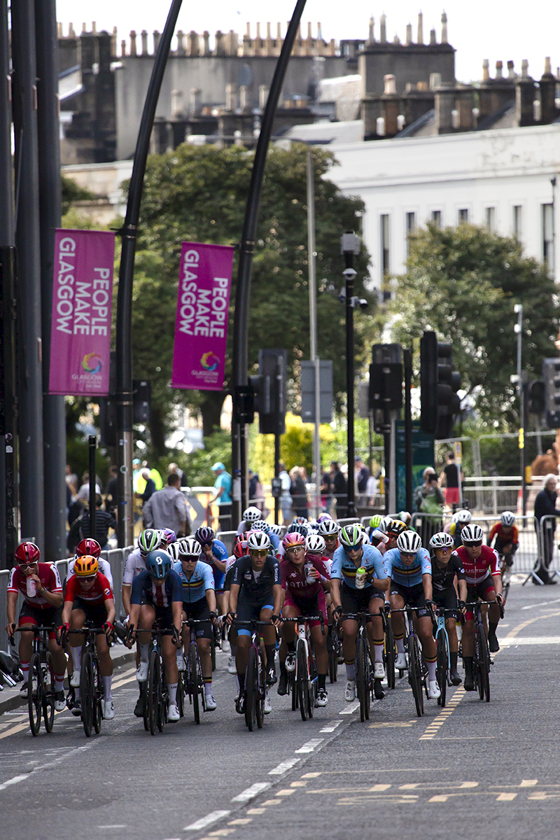 2023 UCI Cycling World Championships - Road Race - Elite Women - The riders on Sauchiehall Street with Glasgow 2023 banners on the lamposts