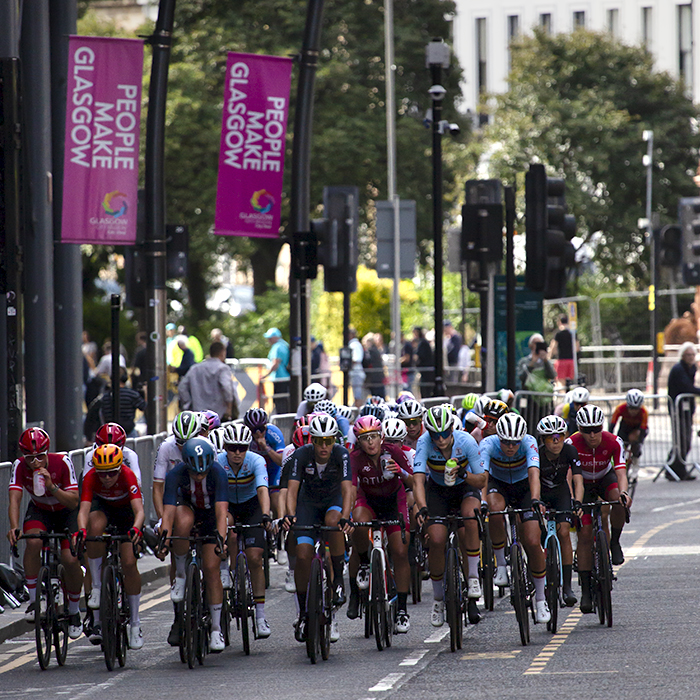 2023 UCI Cycling World Championships - Road Race - Elite Women - The riders on Sauchiehall Street with Glasgow 2023 banners on the lamposts