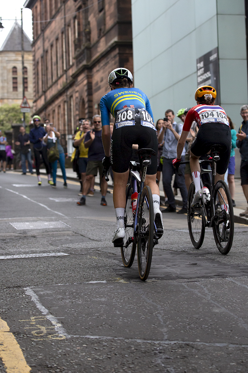 2023 UCI Cycling World Championships - Road Race - Elite Women - Riders pass the Glasgow School of Art on Scott Street