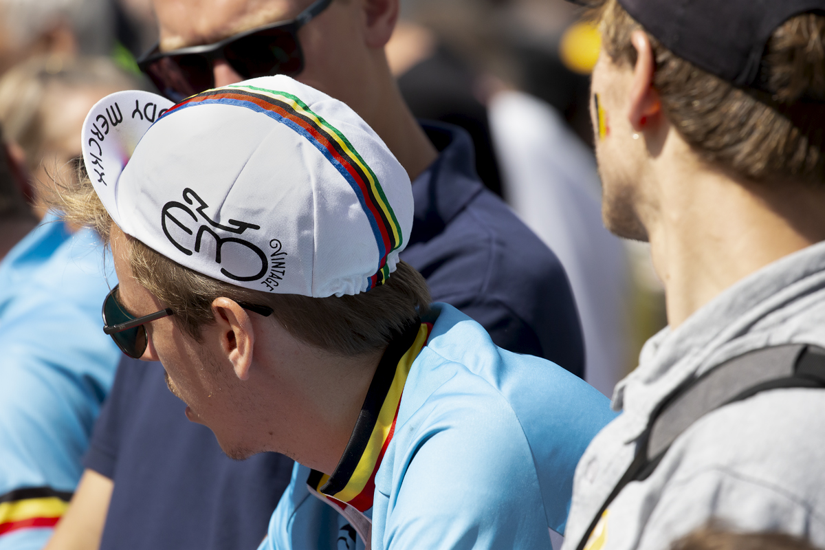 2023 UCI Cycling World Championships - Time Trial - Elite Men - A Belgian fan wearing an Eddy Merckx world champion cap watches the race