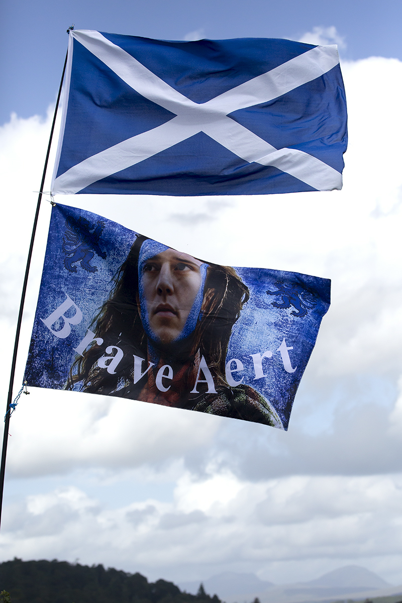 2023 UCI Cycling World Championships - Time Trial - Elite Men - A Saltire and a flag with Wout van Aert depicted as a Scottish warrior and the caption Brave Aert