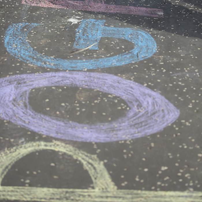 2023 UCI Cycling World Championships - Time Trial - Elite Men - Pogačar written on the pavement in different coloured chalk