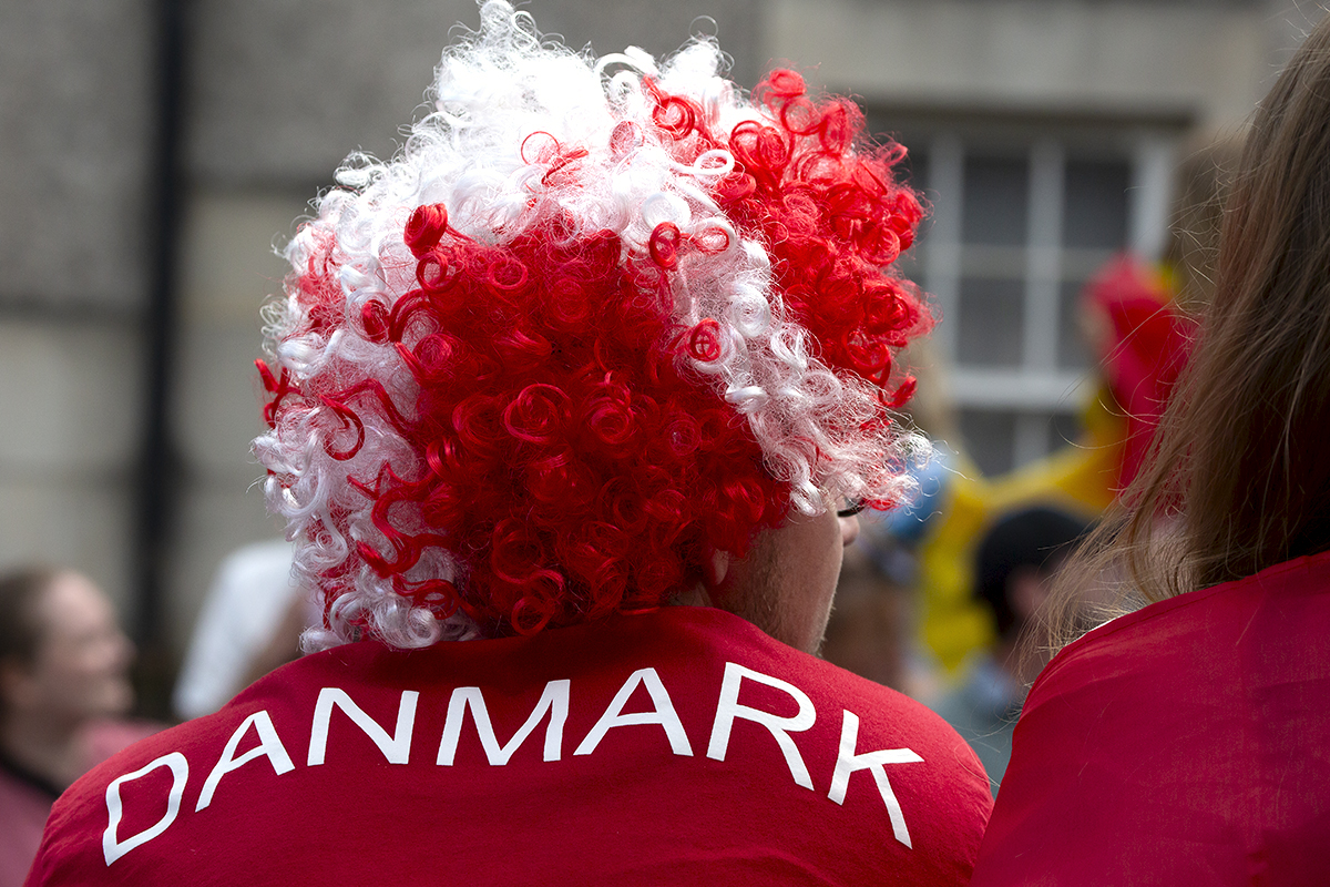 2023 UCI Cycling World Championships - Time Trial - Elite Men - A Danish fan with a wig of the Danish Flag watches the action