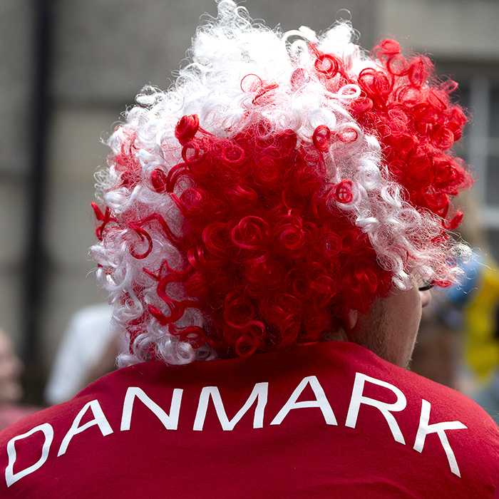 2023 UCI Cycling World Championships - Time Trial - Elite Men - A Danish fan with a wig of the Danish Flag watches the action