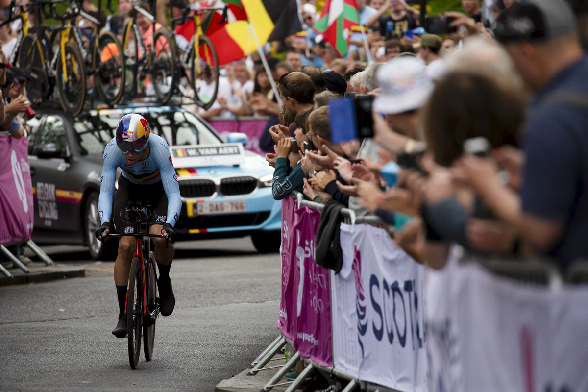 2023 UCI Cycling World Championships - Time Trial - Elite Men - Wout van Aert of Belgium makes his way up the final climb cheered on by large crowds waving Belgium flags