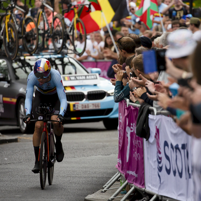 2023 UCI Cycling World Championships - Time Trial - Elite Men - Wout van Aert of Belgium makes his way up the final climb cheered on by large crowds waving Belgium flags