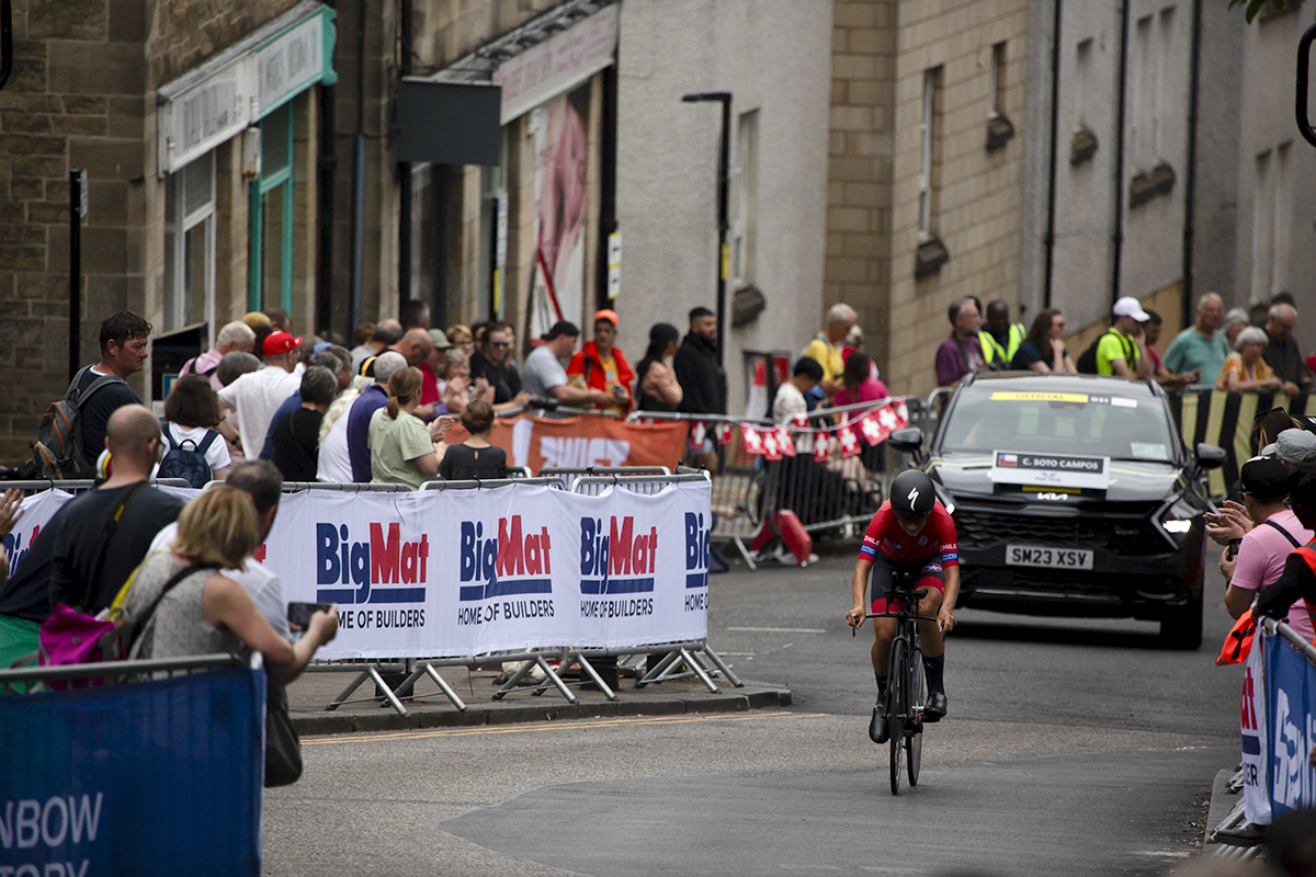 2023 UCI Cycling World Championships - Time Trial - Elite Women -  Catalina Soto Campos of Chile is followed by her support vehicle as she climbs through the streets of Stirling