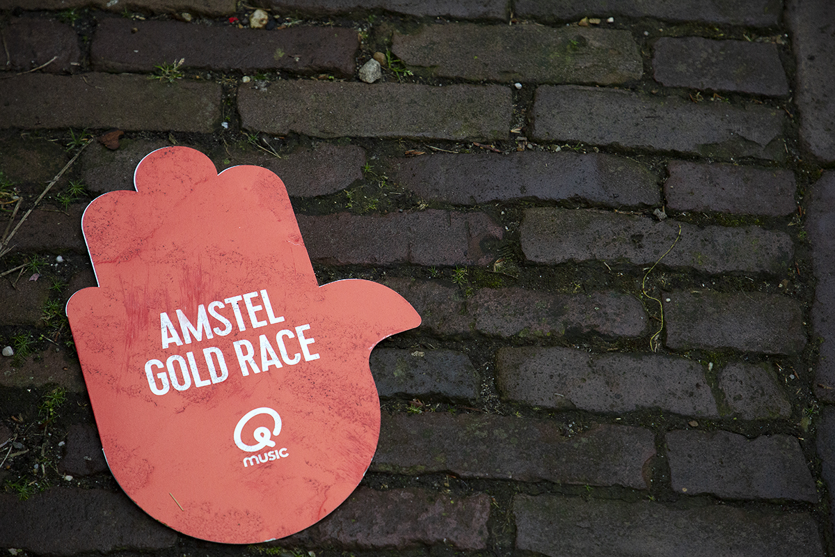 Amstel Gold Race 2023 - Amstel Gold Race red hand merchandise left behind by the caravan on the cobbles of the Maasberg