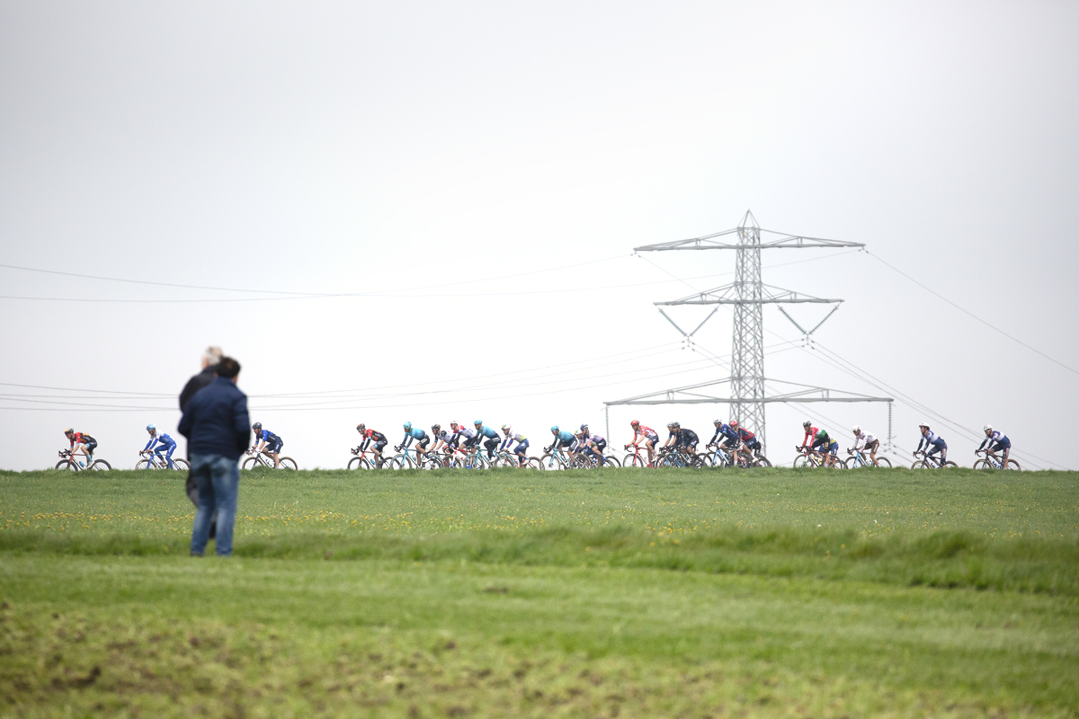 Amstel Gold Race 2023 - Fans watch the peloton on Schaapdries with a pylon in the background