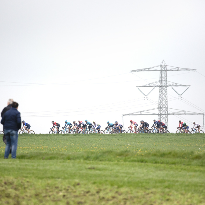 Amstel Gold Race 2023 - Fans watch the peloton on Schaapdries with a pylon in the background