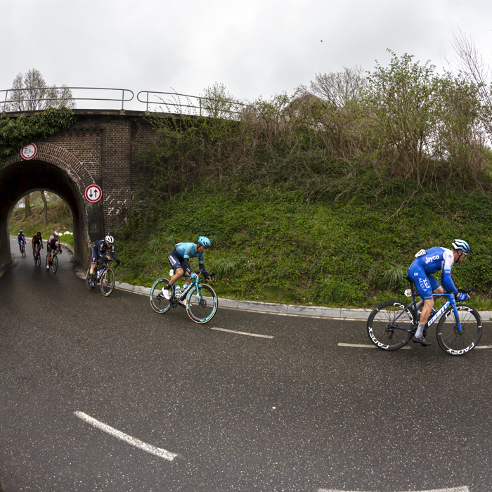 Amstel Gold Race 2023 - Riders pass under a railway bridge in Schoonbron