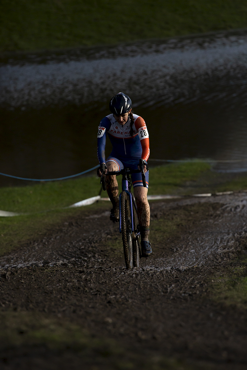 British National Cyclo-Cross Championships 2023 - Carly Ibbitson rides uphill through muddy tracks