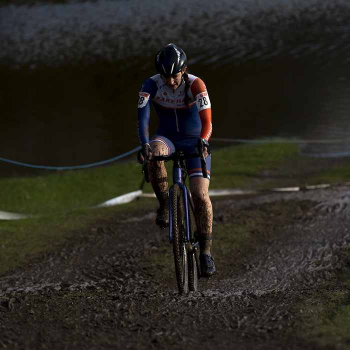 British National Cyclo-Cross Championships 2023 - Carly Ibbitson rides uphill through muddy tracks