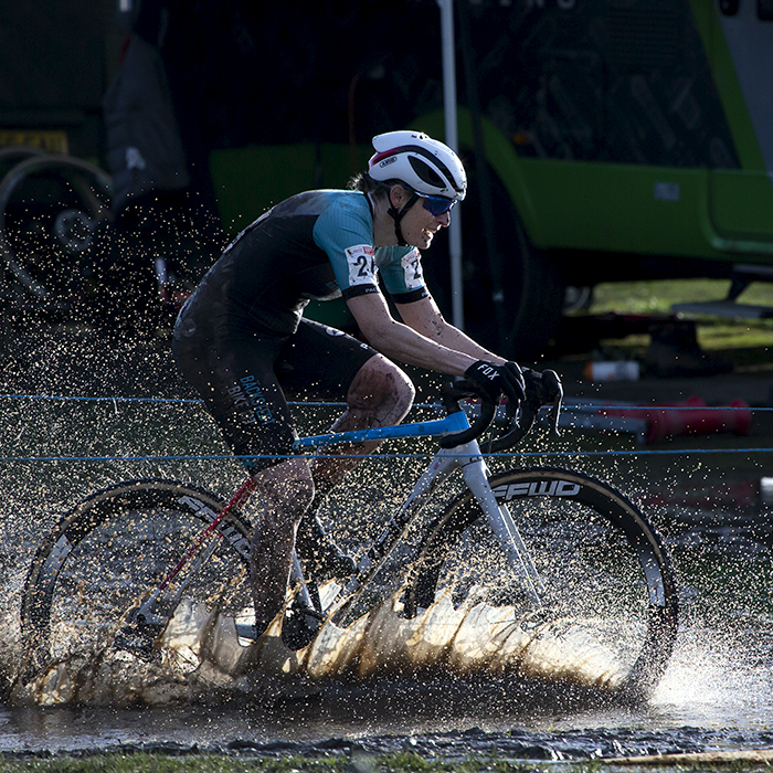 British National Cyclo-Cross Championships 2023 - Water splashes up as Ceris Styler rides on the course