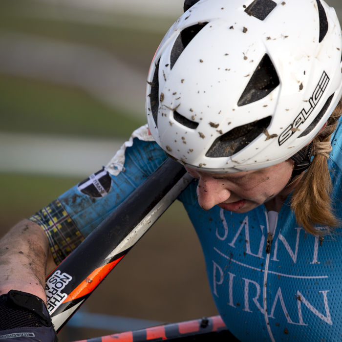 British National Cyclo-Cross Championships 2023 - Christina Wiejak carries her bike on her shoulder with her head down