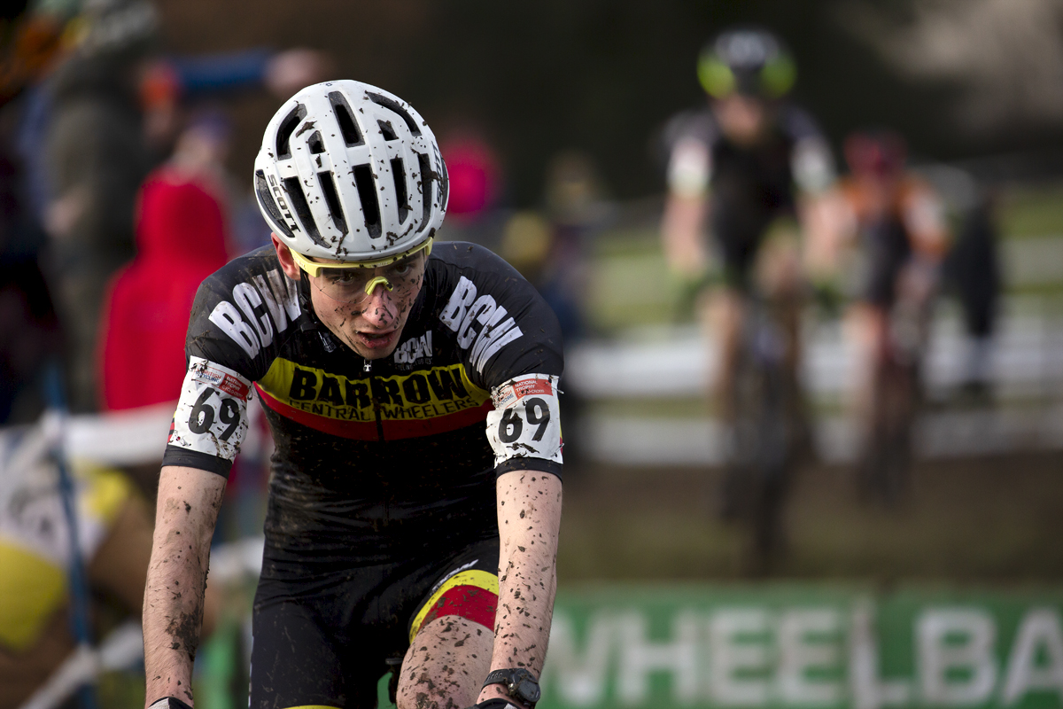 British National Cyclo-Cross Championships 2023 - George Baker is splashed in mud as he completes the hurdles section