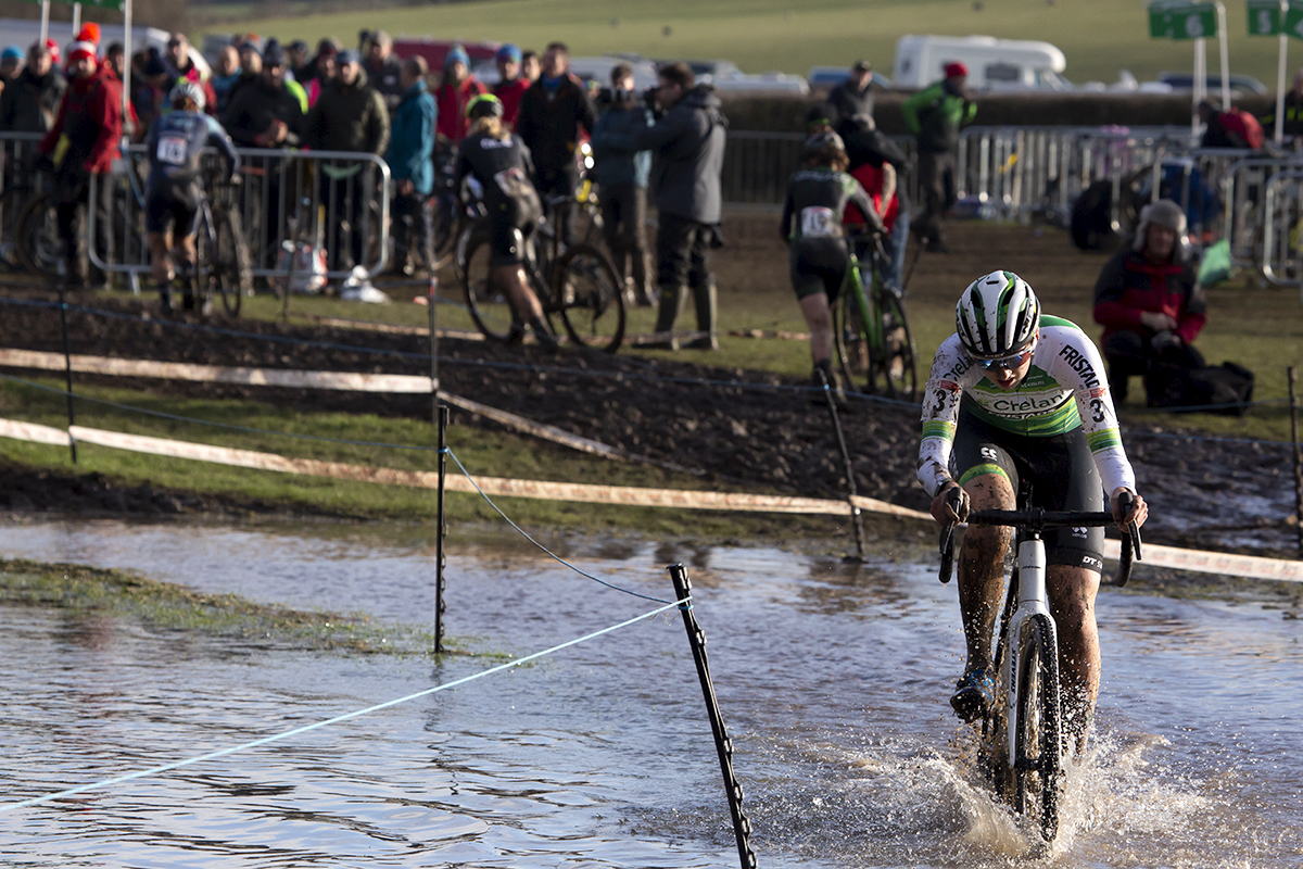 British National Cyclo-Cross Championships 2023 - Millie Couzens rides through a large waterlogged area