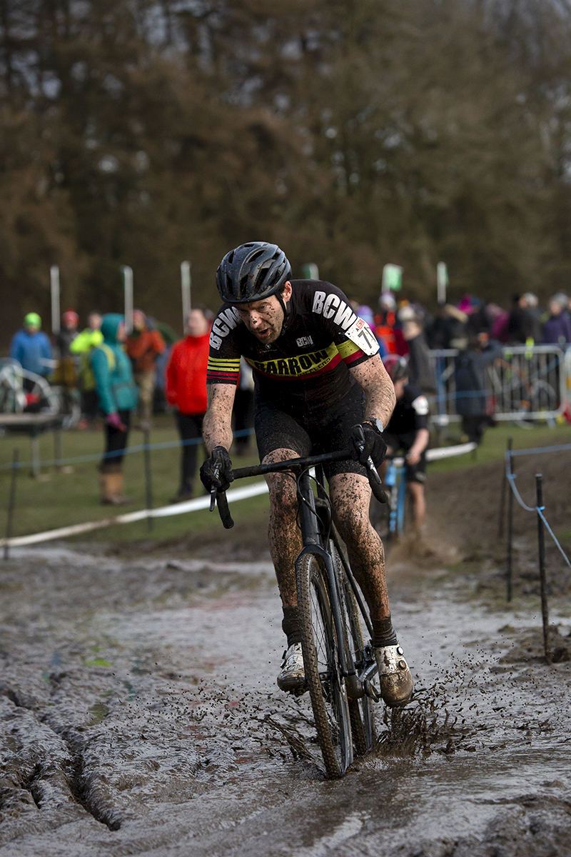 British National Cyclo-Cross Championships 2023 - Richard Morgan cycles through a wet muddy area of the course