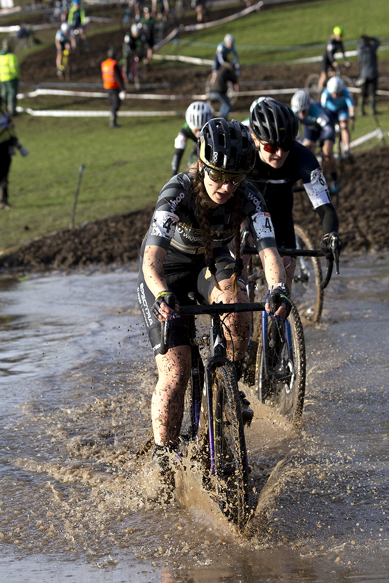 British National Cyclo-Cross Championships 2023 - Xan Crees leads a group of riders through the water