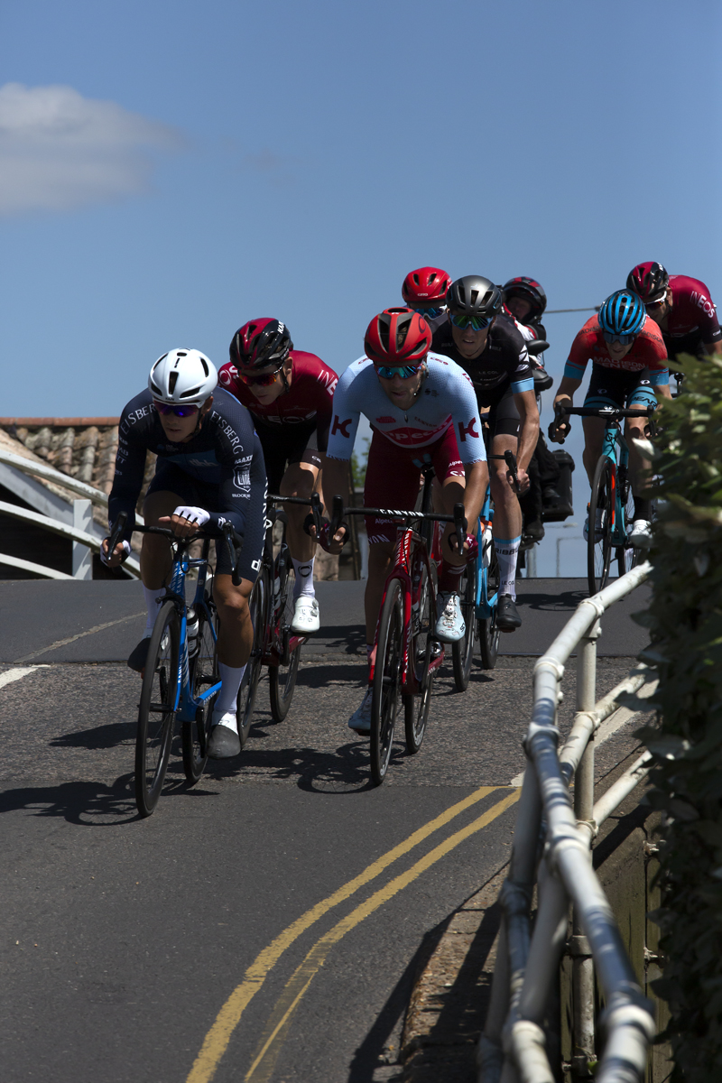 British National Road Championships 2019 - The riders top the hump of a bridge and descend