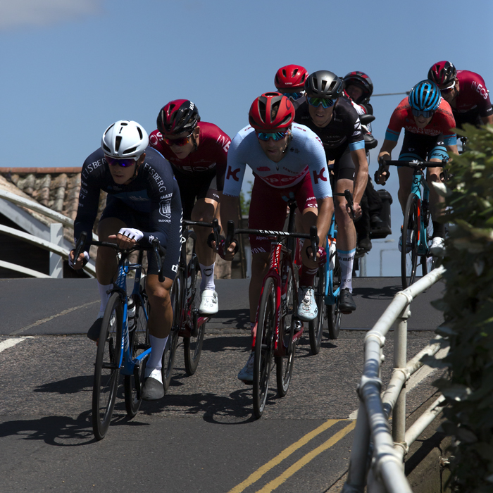 British National Road Championships 2019 - The riders top the hump of a bridge and descend