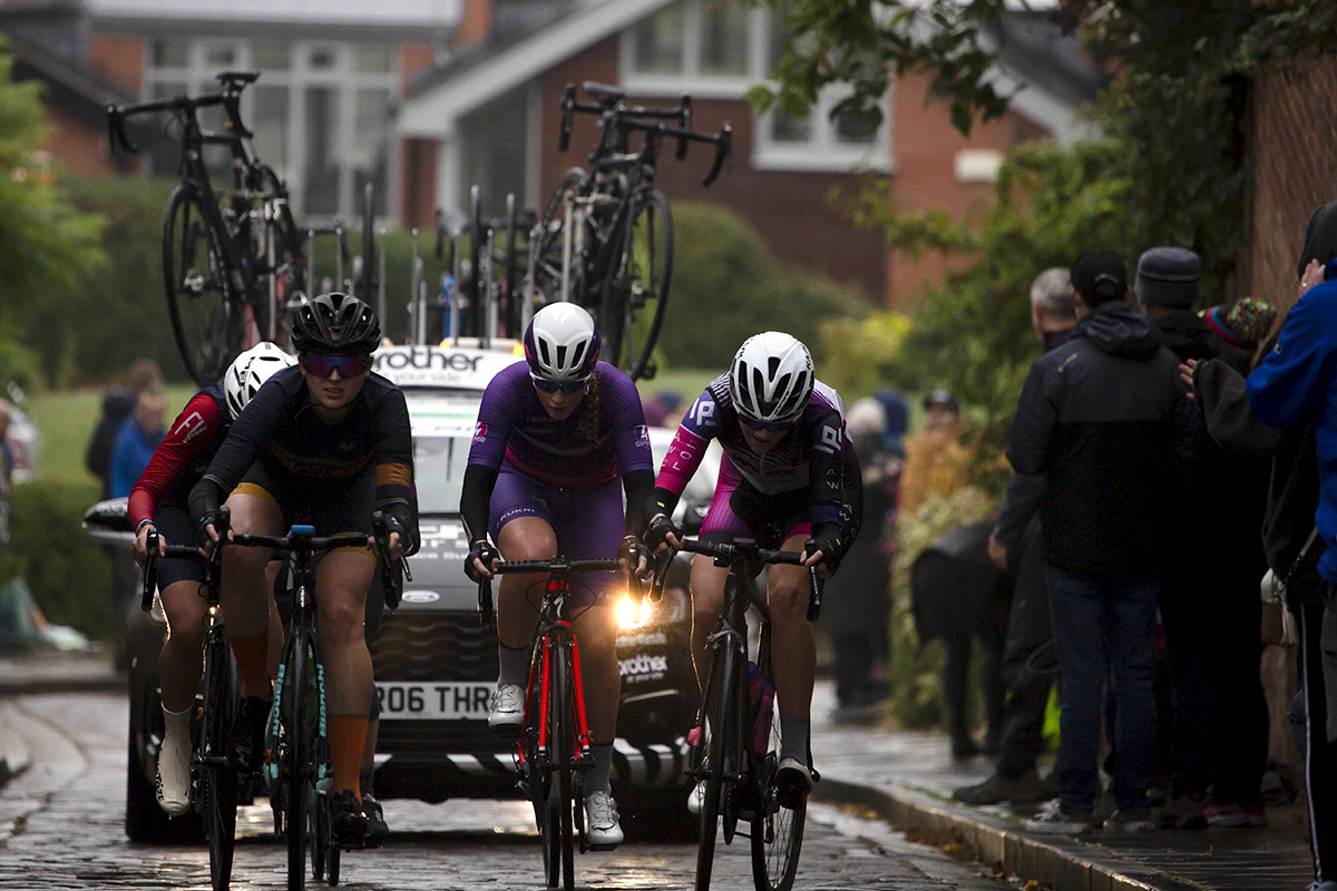 British National Road Championships 2021 - Women’s Road Race - A group of riders followed by a team car tackle the climb