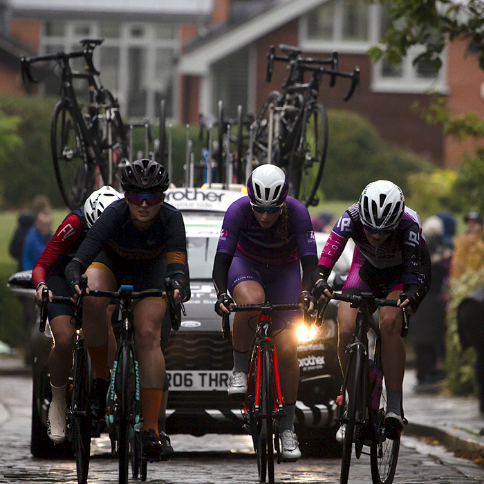 British National Road Championships 2021 - Women’s Road Race - A group of riders followed by a team car tackle the climb