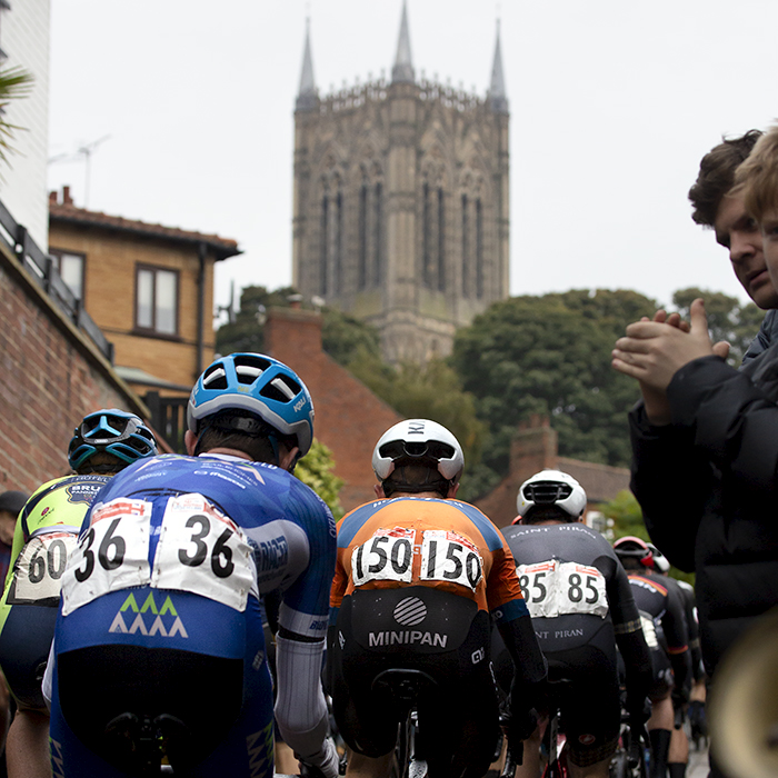 British National Road Championships 2021 - Men’s Road Race - Rear view of the peloton with Lincoln Cathedral in the background