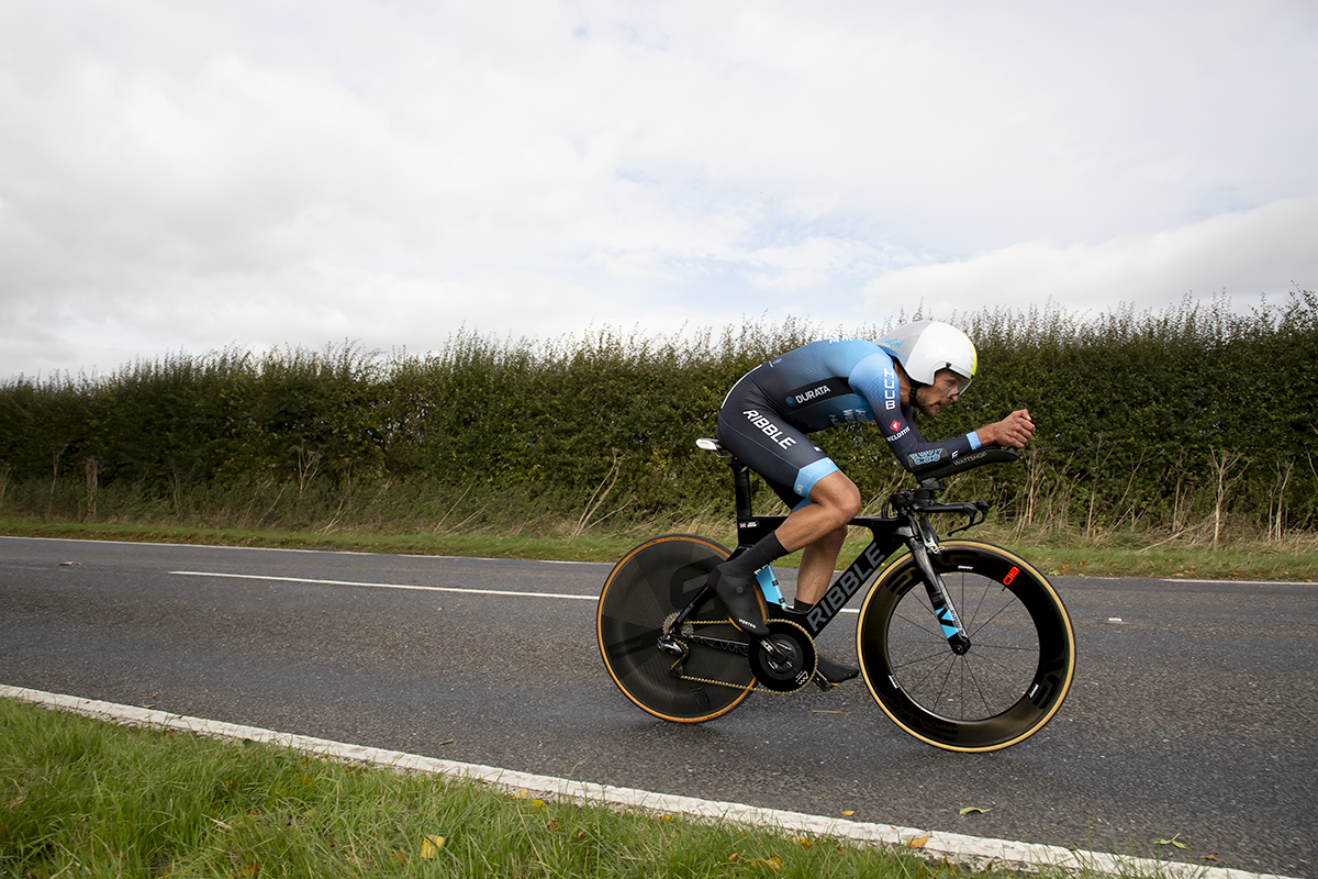 British National Road Championships 2022 - Men’s Time Trial - James Shaw of Ribble Weldtite Pro Cycling speeds past hedgerows during the event