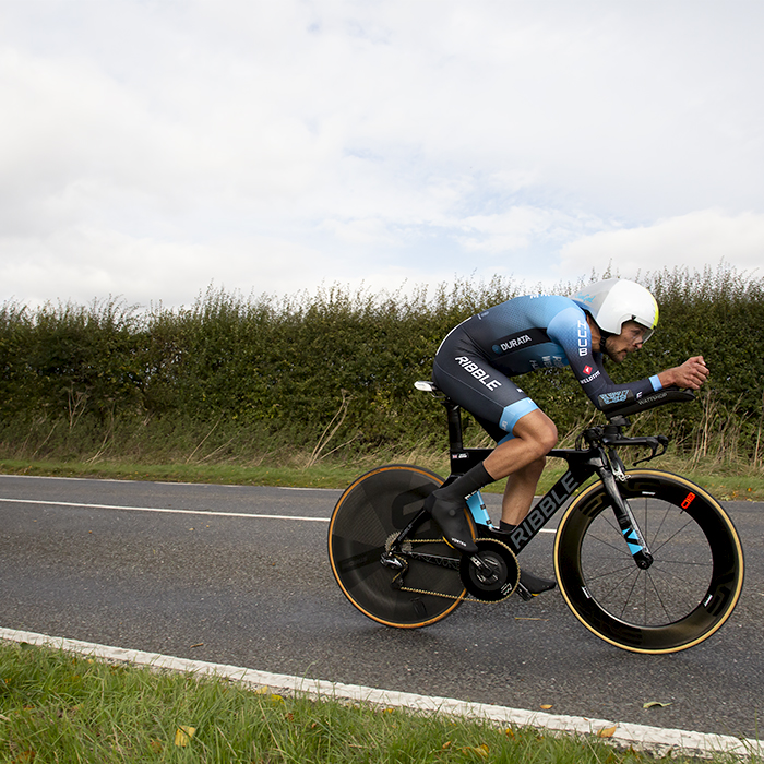 British National Road Championships 2022 - Men’s Time Trial - James Shaw of Ribble Weldtite Pro Cycling speeds past hedgerows during the event