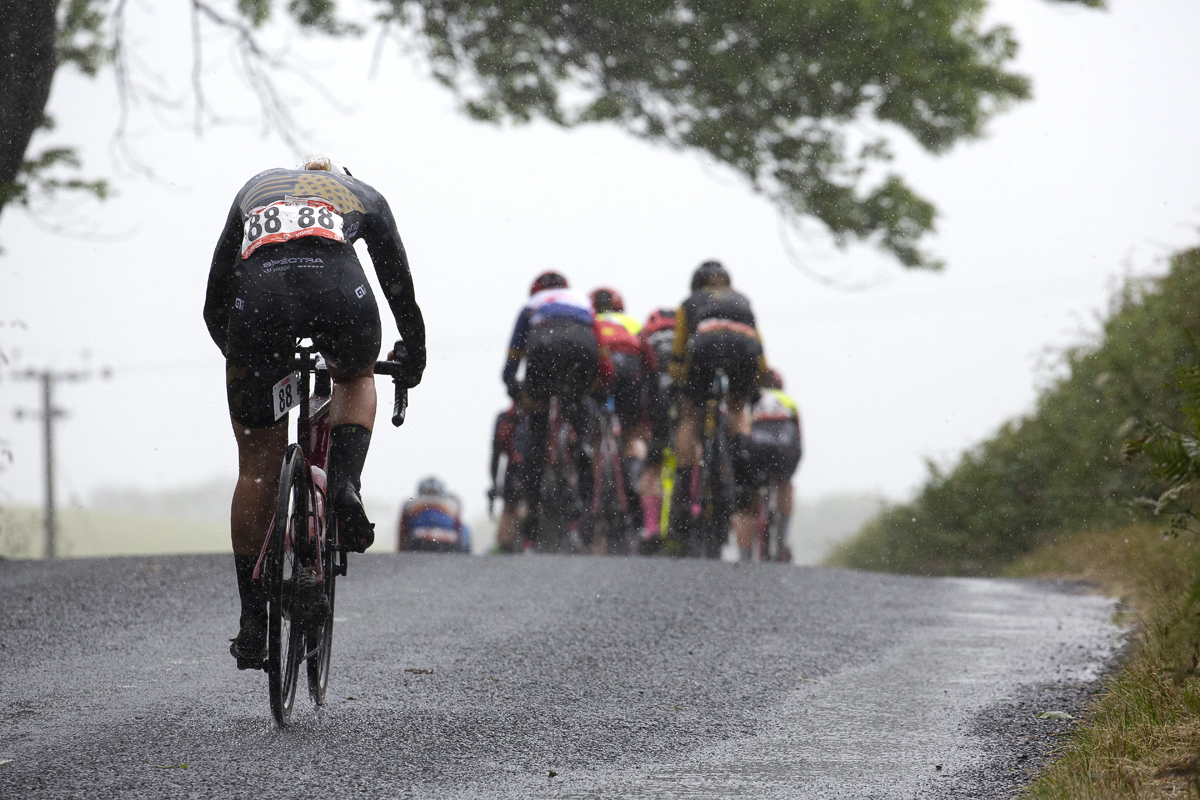 British National Road Championships 2022 - Women’s Road Race - Amira Mellor of Spectra Wiggle p/b Vitus fights to catch the group in the pouring rain