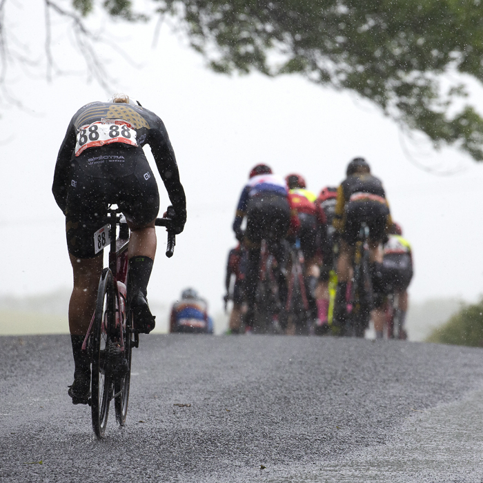 British National Road Championships 2022 - Women’s Road Race - Amira Mellor of Spectra Wiggle p/b Vitus fights to catch the group in the pouring rain