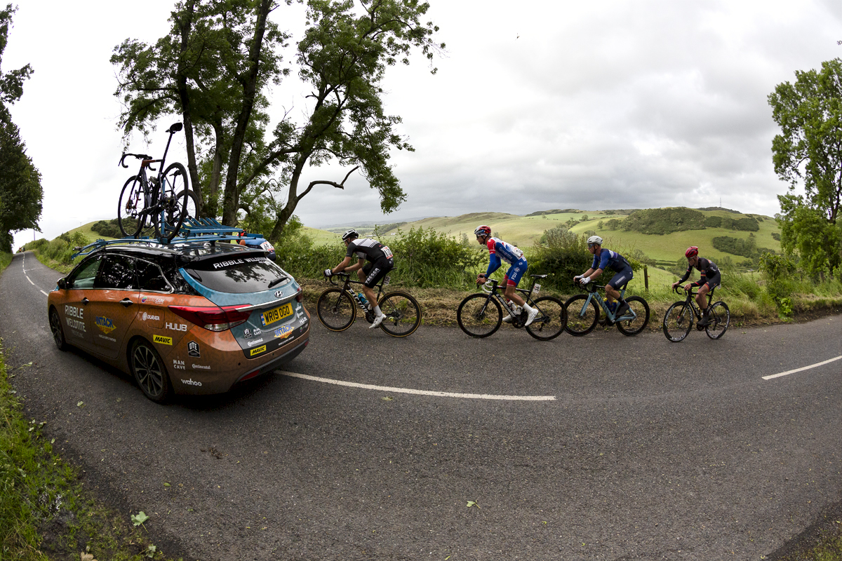 British National Road Championships 2022 - Men’s Road Race -  Riders pass by a panoramic view with a Ribble team car leading the way