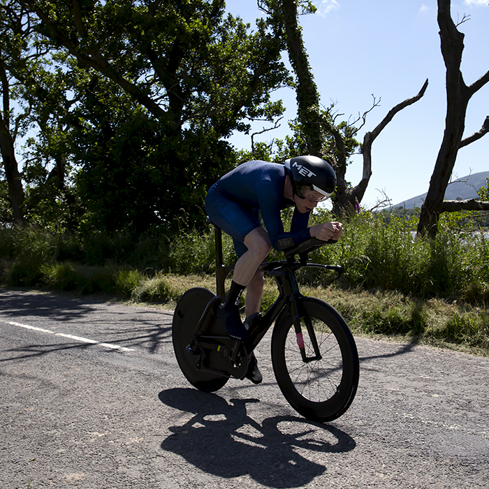 British National Road Championships 2022 - Men’s Time Trial - George Peasgood of Team HUUB rides past trees 