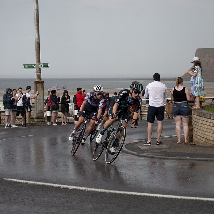 British National Road Championships 2023 - Men’s Road Race - Sean Flynn of Team DSM leads a group up a wet hill climb