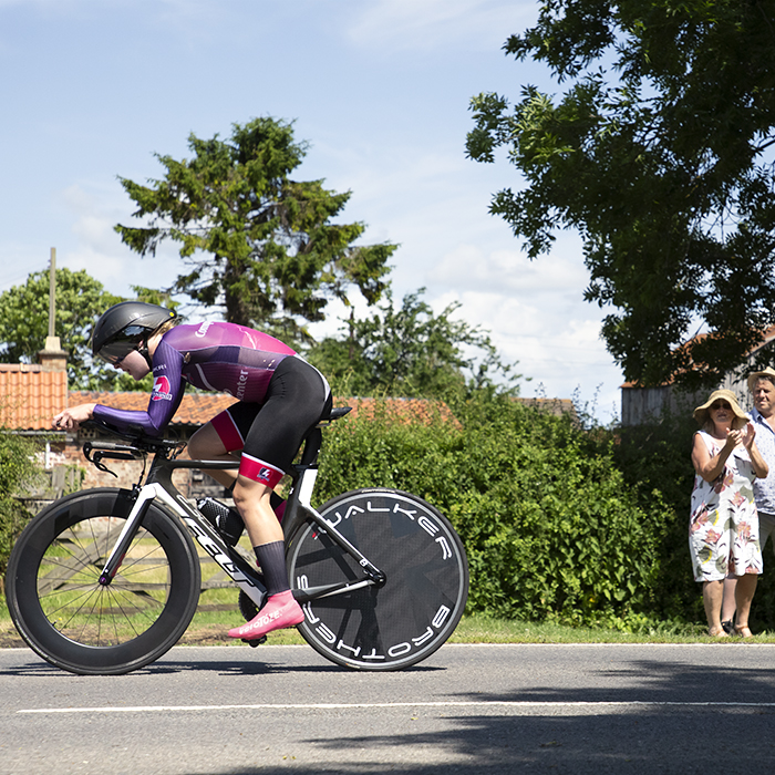 British National Road Championships 2023 - Women’s Time Trial -  A couple in summer clothes watch Amber Harding of Loughborough Lightning taking part in the competition