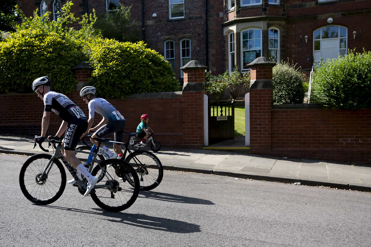 British National Road Championships 2024 - Men’s Road Race - Alexander Ball & William Harding tackle the course as a small child cycles in the opposite direction on the footpath