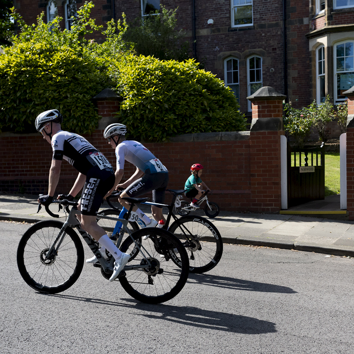 British National Road Championships 2024 - Men’s Road Race - Alexander Ball & William Harding tackle the course as a small child cycles in the opposite direction on the footpath